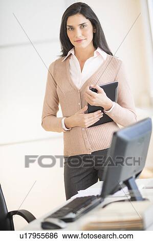 Portrait of businesswoman in office View Large Photo Image Stock Photograph - Portrait of businesswoman in office. Fotosearch