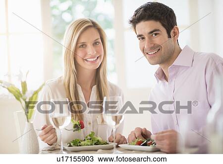 Portrait of couple eating dinner in restaurant View Large Photo Image Stock Image - Portrait of couple eating dinner in restaurant. Fotosearch