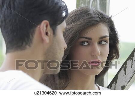 Portrait of couple looking at each other View Large Photo Image Stock Image - Portrait of couple looking at each other. Fotosearch