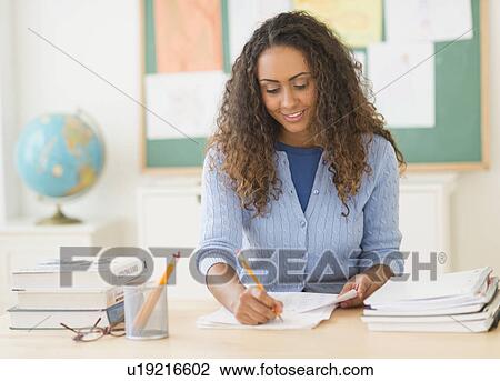 Portrait of elementary school teacher in class View Large Photo Image Stock Image - Portrait of elementary school teacher in class. Fotosearch