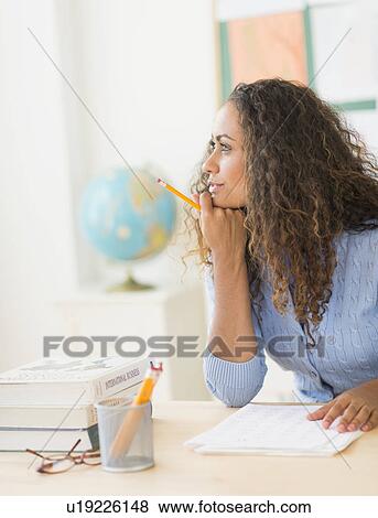 Stock Photo - Portrait of elementary school teacher in class. Fotosearch