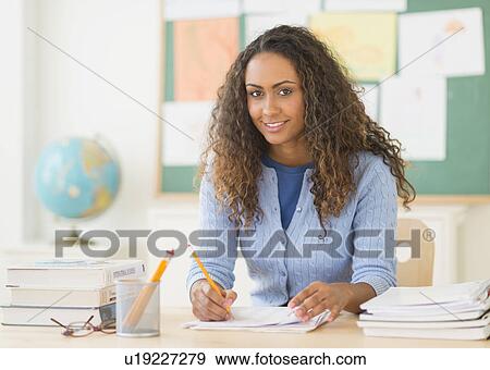 Stock Photo - Portrait of elementary school teacher in class. Fotosearch