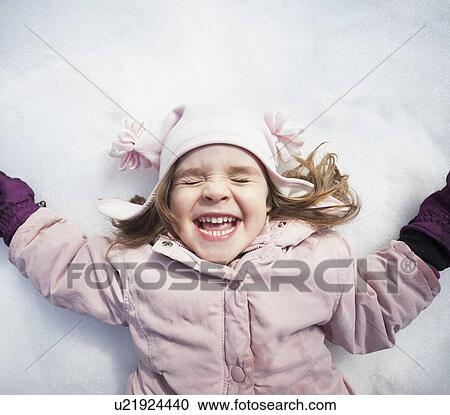Portrait of Girl (2-3) lying down on snow View Large Photo Image Stock Image - Portrait of Girl (2-3) lying down on snow. Fotosearch