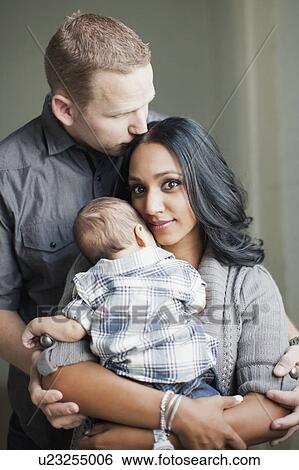 Portrait of happy multiethnic family View Large Photo Image Stock Photograph - Portrait of happy multiethnic family. Fotosearch