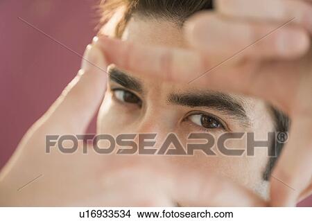 Portrait of man making finger frame View Large Photo Image Picture - Portrait of man making finger frame. Fotosearch