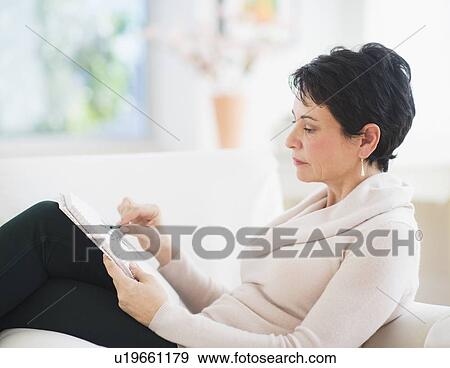 Stock Photo - Portrait of mature woman drawing. Fotosearch