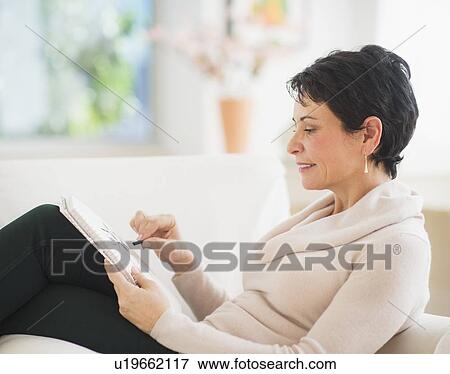 Portrait of mature woman drawing View Large Photo Image Stock Photo - Portrait of mature woman drawing. Fotosearch