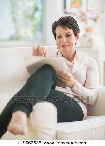 Portrait of mature woman drawing View Large Photo Image Stock Photography - Portrait of mature woman drawing. Fotosearch