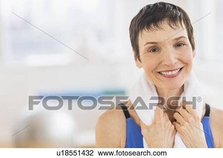 Portrait of mature woman in gym View Large Photo Image Stock Image - Portrait of mature woman in gym. Fotosearch