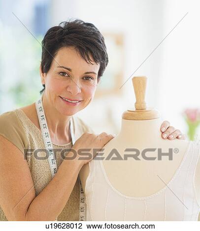 Stock Image - Portrait of mature woman with clothing bust. Fotosearch