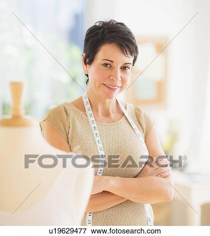 Stock Photo - Portrait of mature woman with clothing bust. Fotosearch