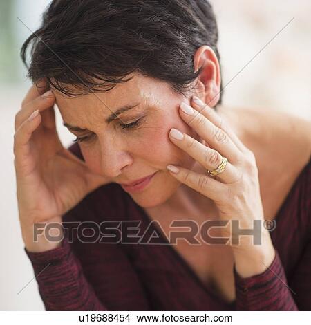 Portrait of mature woman with hands on head View Large Photo Image Picture - Portrait of mature woman with hands on head. Fotosearch
