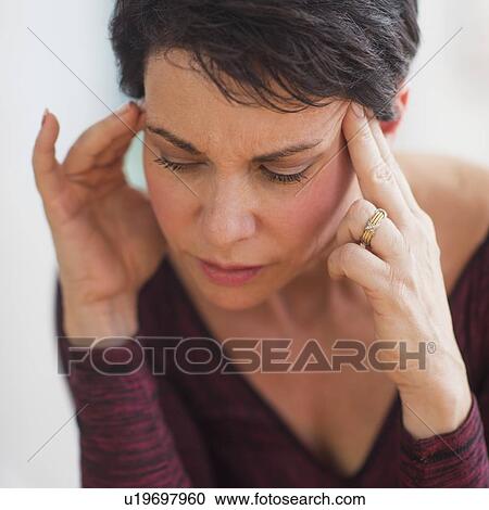 Portrait of mature woman with hands on head View Large Photo Image Stock Image - Portrait of mature woman with hands on head. Fotosearch