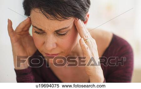 Portrait of mature woman with hands on head View Large Photo Image Stock Photography - Portrait of mature woman with hands on head. Fotosearch