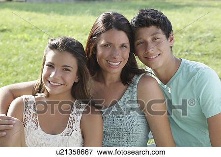 Portrait of mother with daughter (12-13) and son (14-15) View Large Photo Image Stock Photo - Portrait of mother with daughter (12-13) and son (14-15). Fotosearch