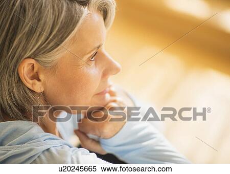 Stock Photography - Portrait of pensive woman. Fotosearch