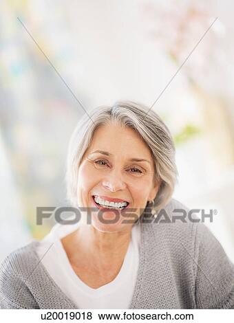 Stock Photo - Portrait of smiling woman. Fotosearch
