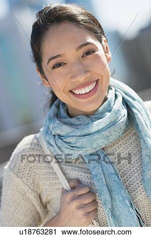 Stock Image - Portrait of smiling young woman. Fotosearch