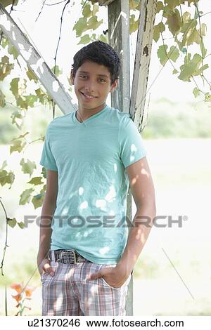 Stock Photograph - Portrait of teenage boy (14-15). Fotosearch