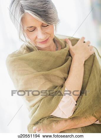 Portrait of woman covered with scarf View Large Photo Image Picture - Portrait of woman covered with scarf. Fotosearch