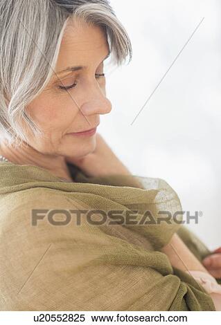 Stock Photography - Portrait of woman covered with scarf. Fotosearch