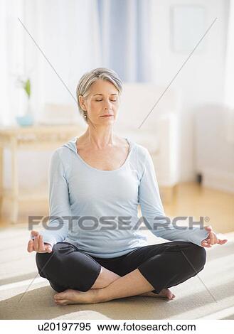 Portrait of woman doing yoga View Large Photo Image Stock Photography - Portrait of woman doing yoga. Fotosearch