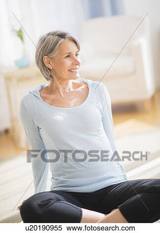 Stock Photography - Portrait of woman exercising. Fotosearch