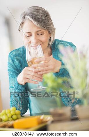 Portrait of woman holding wine glass View Large Photo Image Stock Photo - Portrait of woman holding wine glass. Fotosearch