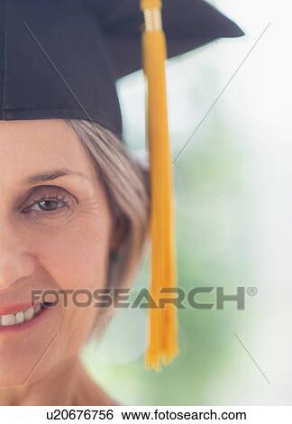 Portrait of woman in graduation cap View Large Photo Image Stock Photograph - Portrait of woman in graduation cap. Fotosearch