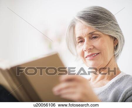 Portrait of woman reading View Large Photo Image Stock Photograph - Portrait of woman reading. Fotosearch