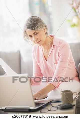 Portrait of woman working at home View Large Photo Image Stock Photo - Portrait of woman working at home. Fotosearch