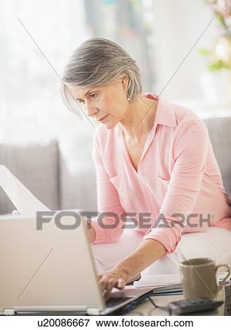 Portrait of woman working at home View Large Photo Image Stock Photo - Portrait of woman working at home. Fotosearch