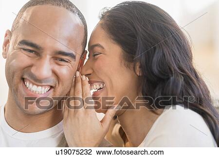 Stock Image - Portrait of young couple. Fotosearch