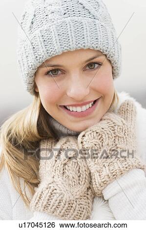 Portrait of young woman in winter clothing View Large Photo Image Stock Photograph - Portrait of young woman in winter clothing. Fotosearch