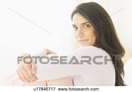 Stock Photo - Portrait of young woman smiling. Fotosearch