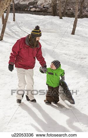 Portrait of young woman with boy (4-5) during stroll View Large Photo Image Stock Photograph - Portrait of young woman with boy (4-5) during stroll. Fotosearch