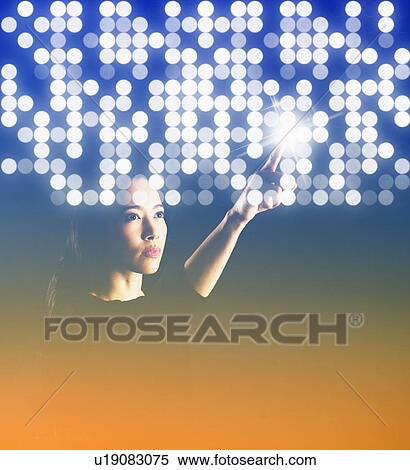 Stock Photography - Portrait of young woman with digital pattern. Fotosearch