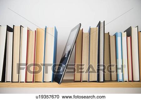 Row of books on shelf View Large Photo Image Stock Image - Row of books on shelf. Fotosearch
