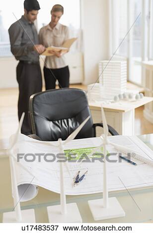 Stock Photo - Scale models of wind turbines on office desk. Fotosearch