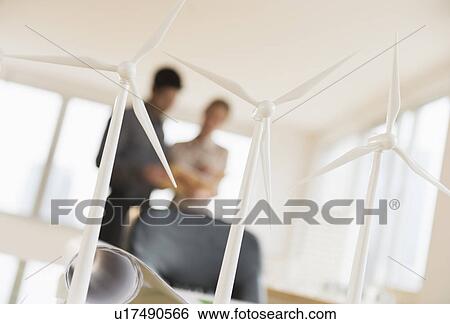 Stock Photograph - Scale models of wind turbines on office desk. Fotosearch