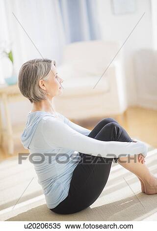 Stock Photography - Side view of woman relaxing. Fotosearch