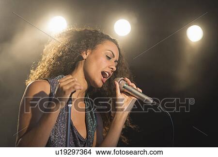 Stage performance of young singer View Large Photo Image Picture - Stage performance of young singer. Fotosearch
