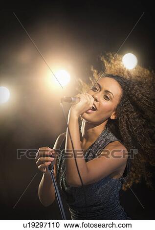 Stage performance of young singer View Large Photo Image Stock Image - Stage performance of young singer. Fotosearch