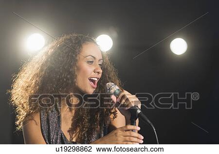 Stage performance of young singer View Large Photo Image Stock Image - Stage performance of young singer. Fotosearch