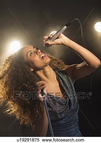 Stage performance of young singer View Large Photo Image Stock Photography - Stage performance of young singer. Fotosearch