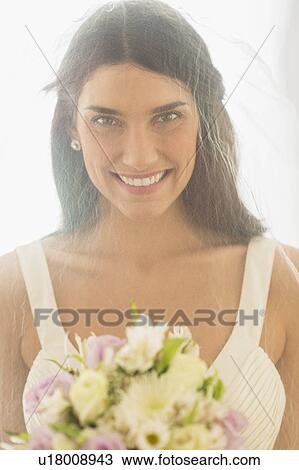 Stock Image - Studio portrait of bride. Fotosearch