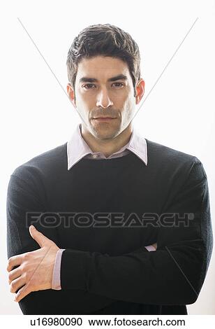Stock Image - Studio portrait of mid adult man. Fotosearch