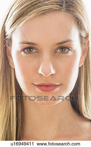 Stock Image - Studio portrait of young woman. Fotosearch