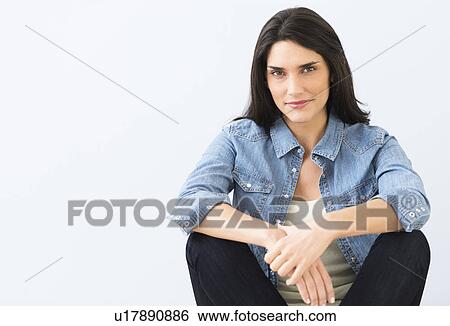 Studio portrait of young woman View Large Photo Image Stock Photograph - Studio portrait of young woman. Fotosearch
