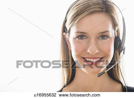 Studio portrait of young woman wearing headset View Large Photo Image Stock Image - Studio portrait of young woman wearing headset. Fotosearch